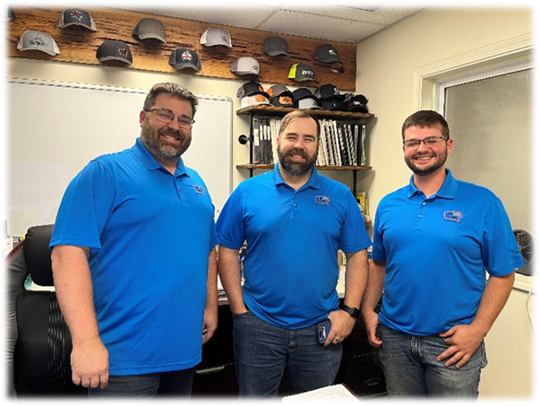 A group of men wearing blue shirts

AI-generated content may be incorrect.