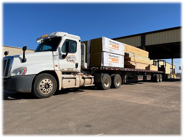 A truck with a load of wood

AI-generated content may be incorrect.