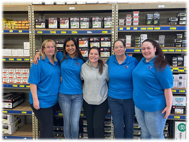 A group of women in blue shirts standing in a store

AI-generated content may be incorrect.
